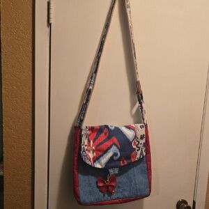 Patchwork Denim Crossbody Bag with Red Accents